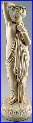 Antique large biscuit figure of semi-nude woman in classical style