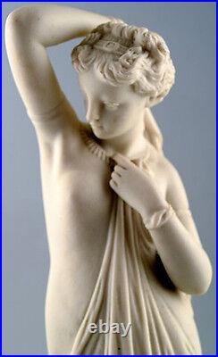 Antique large biscuit figure of semi-nude woman in classical style