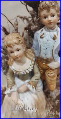 Colonial Couple Statue In Heavy Glass Showcase/Dried Foliage On Wood BaseREAD