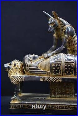 Egyptian god Anubis, the god of mummification, mummify King Tutankhamun