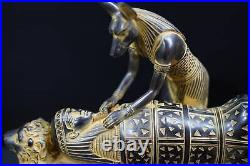 Egyptian god Anubis, the god of mummification, mummify King Tutankhamun