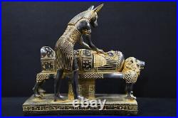 Egyptian god Anubis, the god of mummification, mummify King Tutankhamun