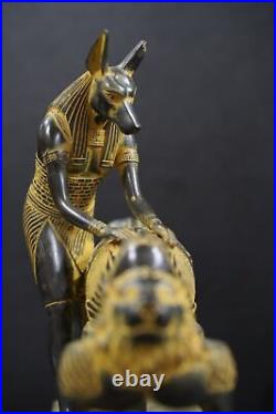 Egyptian god Anubis, the god of mummification, mummify King Tutankhamun