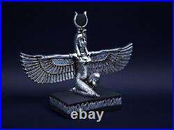 Egyptian statue of the goddess Isis with open wings made of stone & silver leaf
