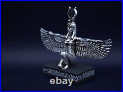 Egyptian statue of the goddess Isis with open wings made of stone & silver leaf