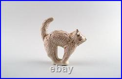 Höganäs, two pottery figurines, cat and skunk. Swedish design