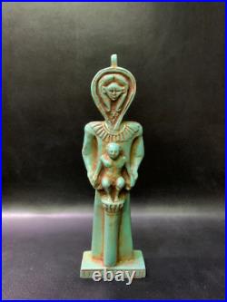 In a perfect scene HATHOR goddess standing as man and taking care of Horus