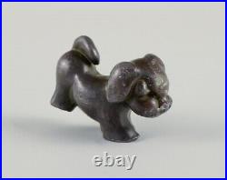 Just Andersen (1884-1943), Denmark. Rare and early puppy in disco metal