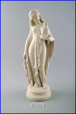 Large English Minton biscuit figure of woman. Classic high quality figure