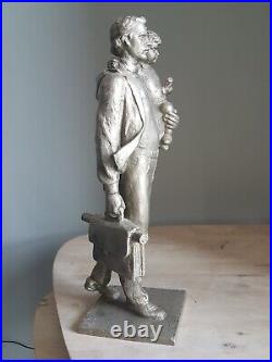 Metal figurine of a Soviet engineer with a child by CHEBATAREV USSR