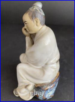 Porcelain Chinese Man Playing Flute