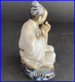 Porcelain Chinese Man Playing Flute