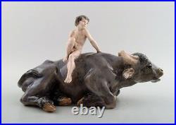 Rare Royal Copenhagen figure, naked boy on water buffalo. Model number 1849