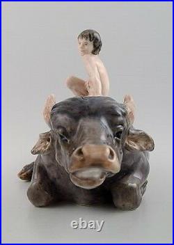 Rare Royal Copenhagen figure, naked boy on water buffalo. Model number 1849