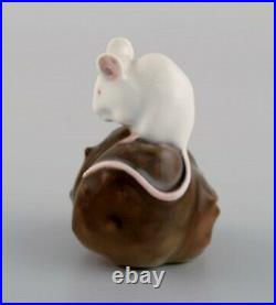 Royal Copenhagen porcelain figurine. Mouse on a chestnut. Early 20th century