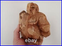 Sculpture of the god Odin made of wood. Statue of Wotan