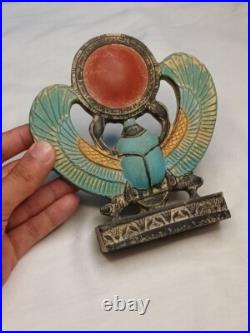 Winged Egyptian Scarab Sacred beetle with solar disk, ancient-inspired art