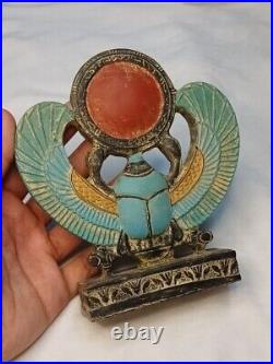 Winged Egyptian Scarab Sacred beetle with solar disk, ancient-inspired art