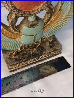 Winged Egyptian Scarab Sacred beetle with solar disk, ancient-inspired art