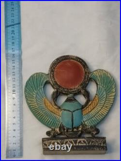 Winged Egyptian Scarab Sacred beetle with solar disk, ancient-inspired art